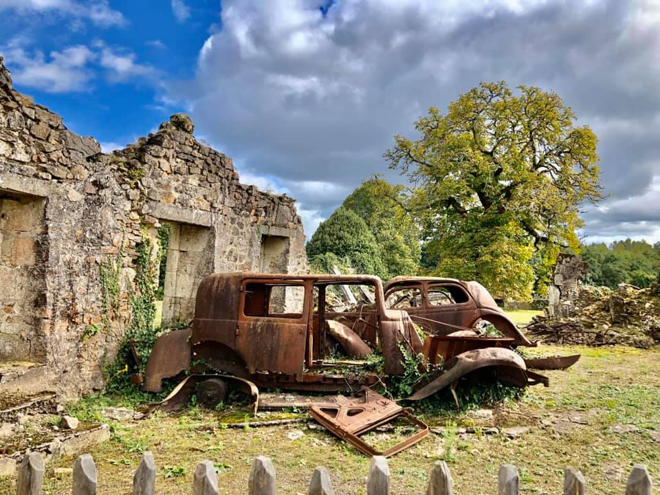 A garage with cars that never moved after that day - The Martyr Village of Oradour sur Glane